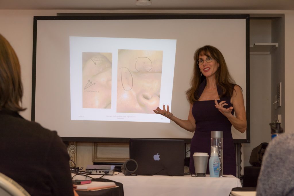 Michelle Gellis teaching facial acupuncture